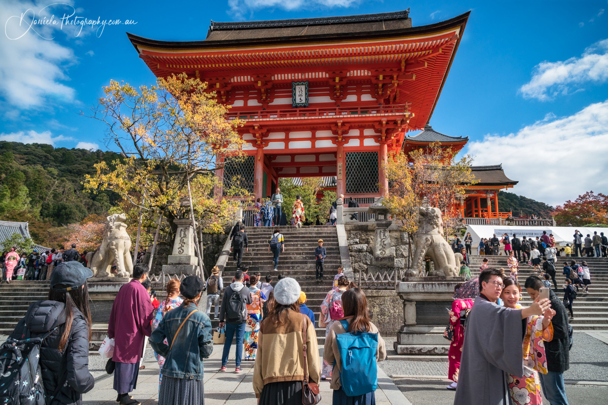 Kyoto Happy People taking pictures and visiting the iconic Kiyomizu dera buddhist temple